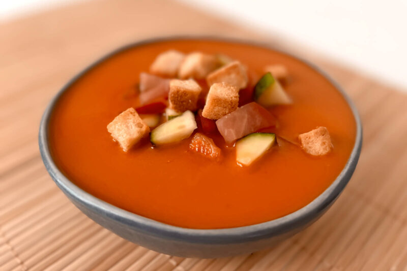 Gazpacho Andaluz, a cold Spanish vegan soup, in a grey bowl